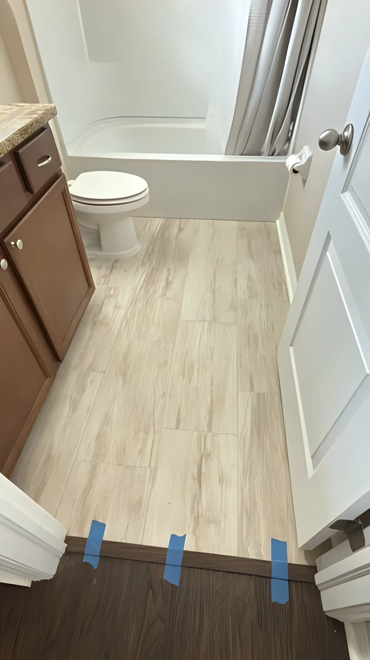 Wood-look flooring installed in a bathroom