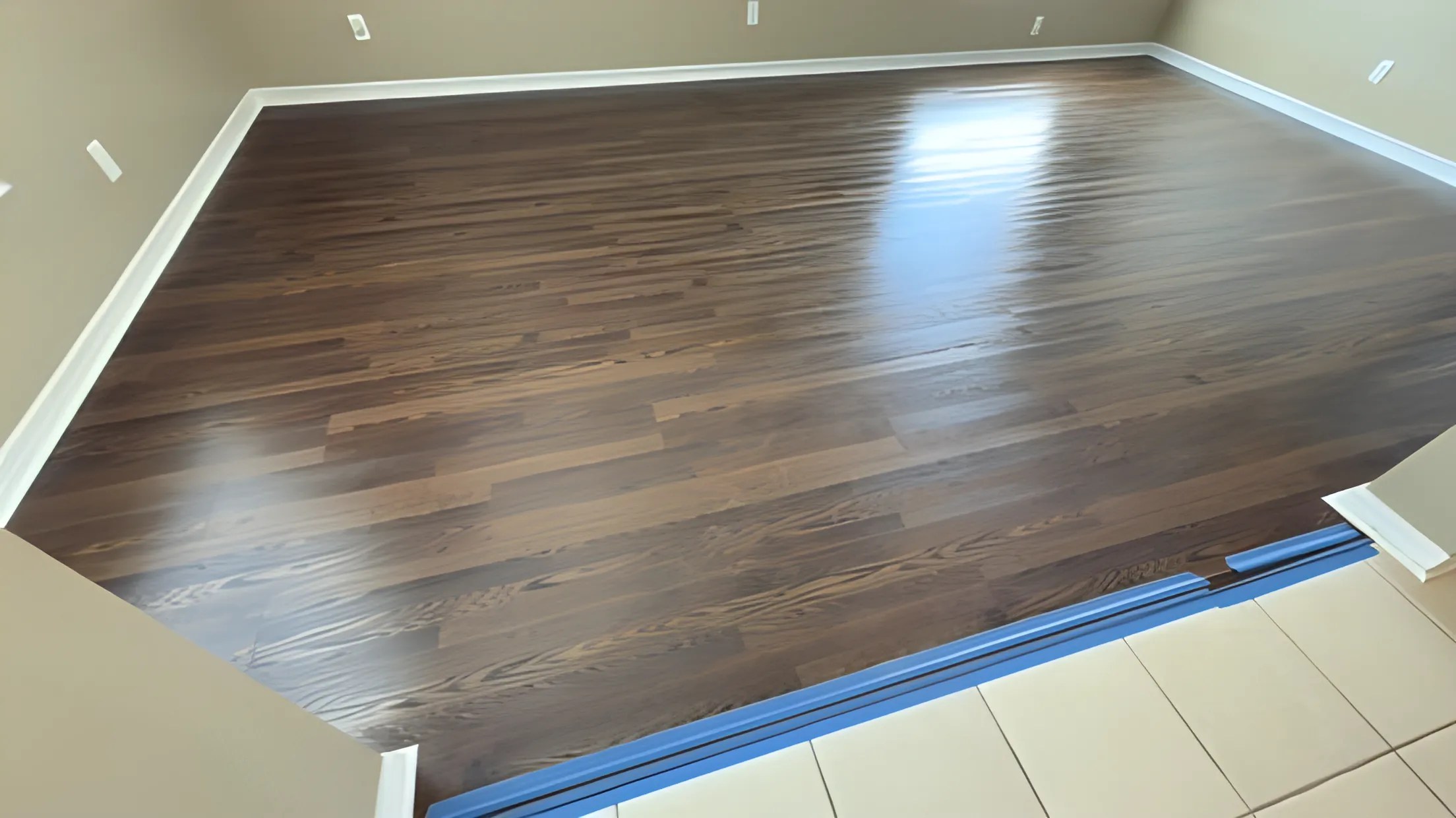 Dark hardwood flooring installed on a diagonal layout