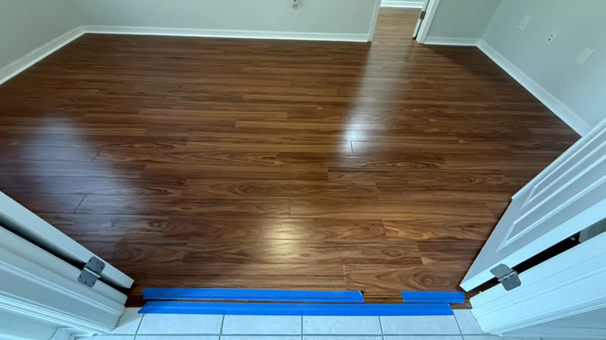 Dark hardwood flooring laid on a diagonal pattern