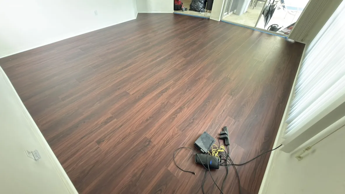 Dark wood-look laminate flooring in an open room