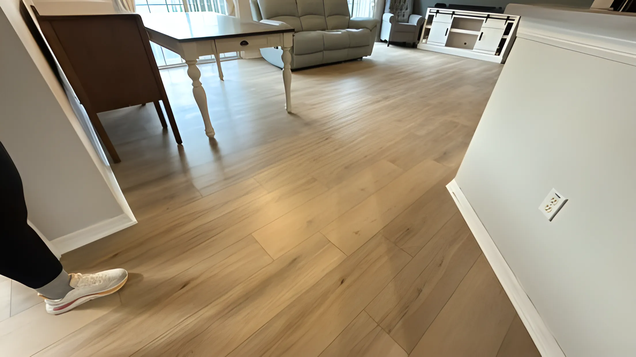 Light oak-tone vinyl plank flooring in a dining room