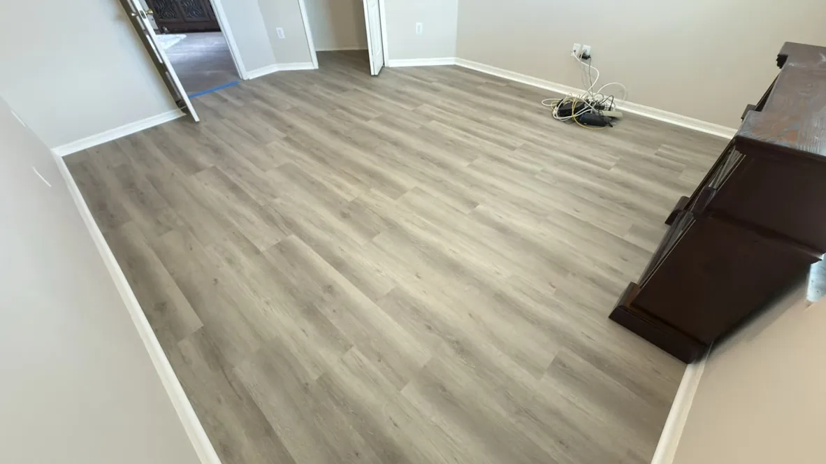 Gray vinyl plank flooring across a great room