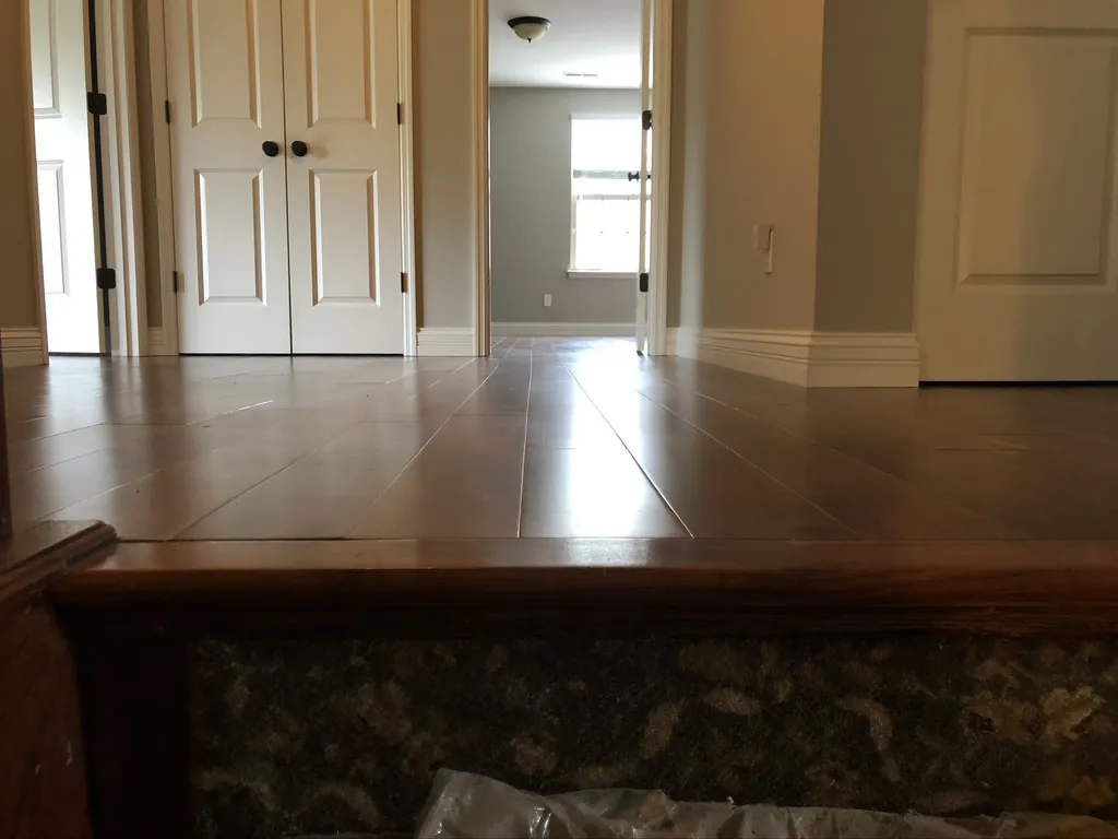 Hardwood flooring in an open entry and hallway