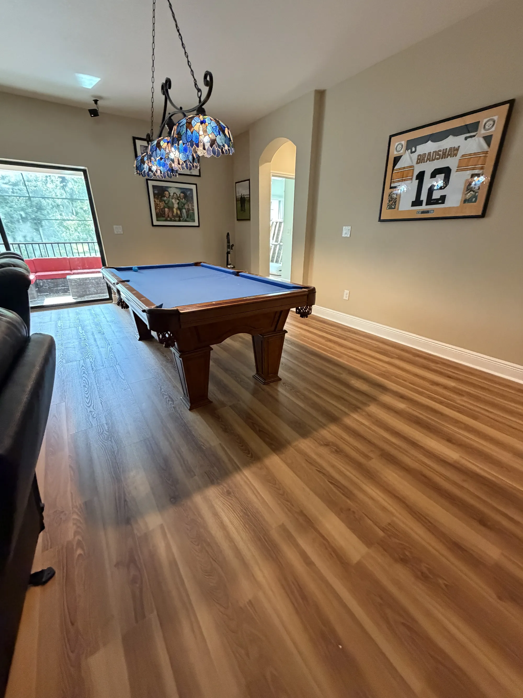 Wide view of laminate flooring in a game room