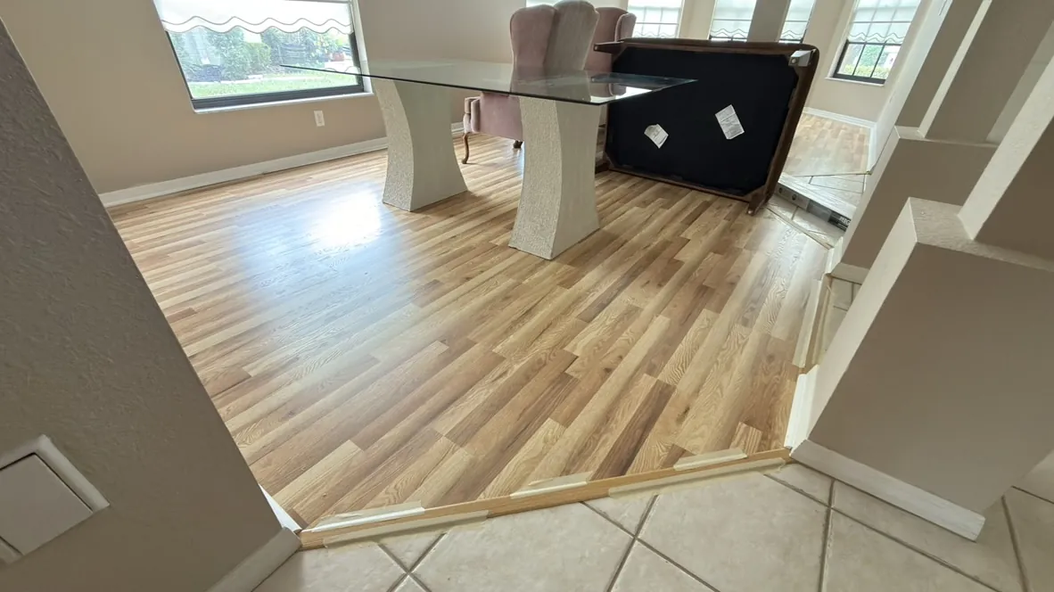 Light vinyl plank flooring in a dining area