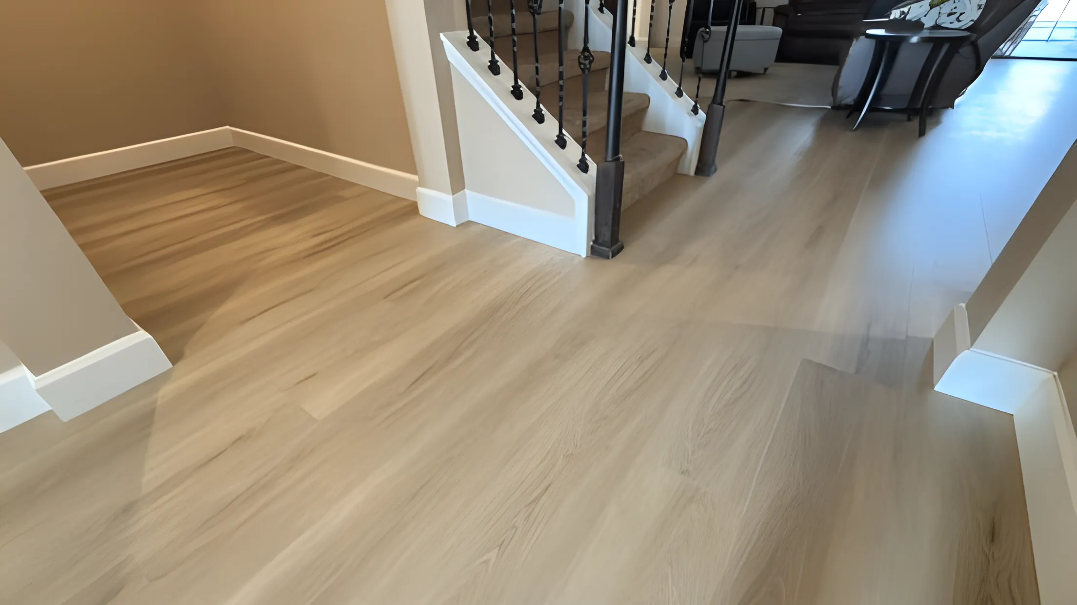 Light vinyl plank flooring in an entry hallway