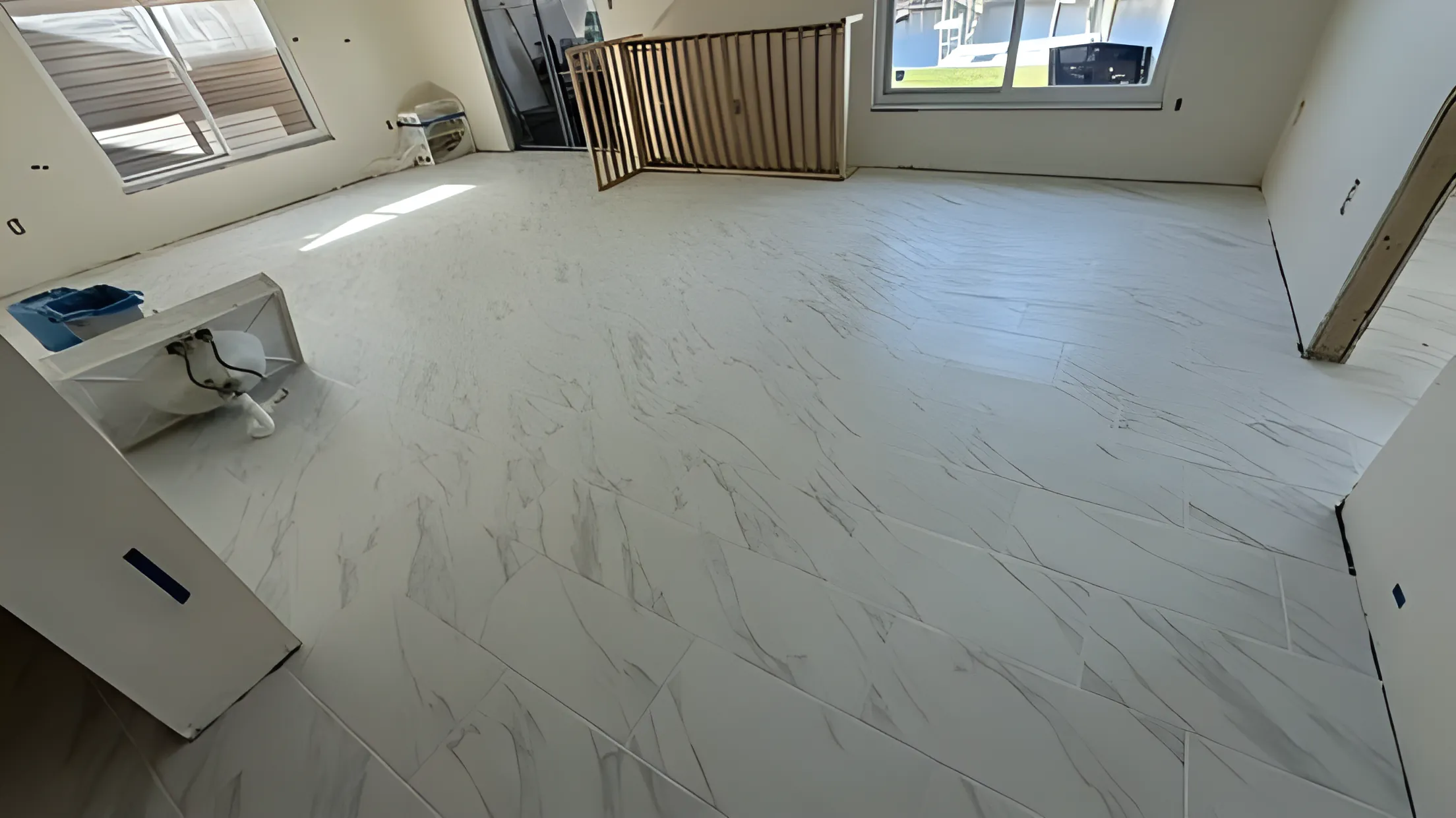 Marble-look tile flooring installed in a living space