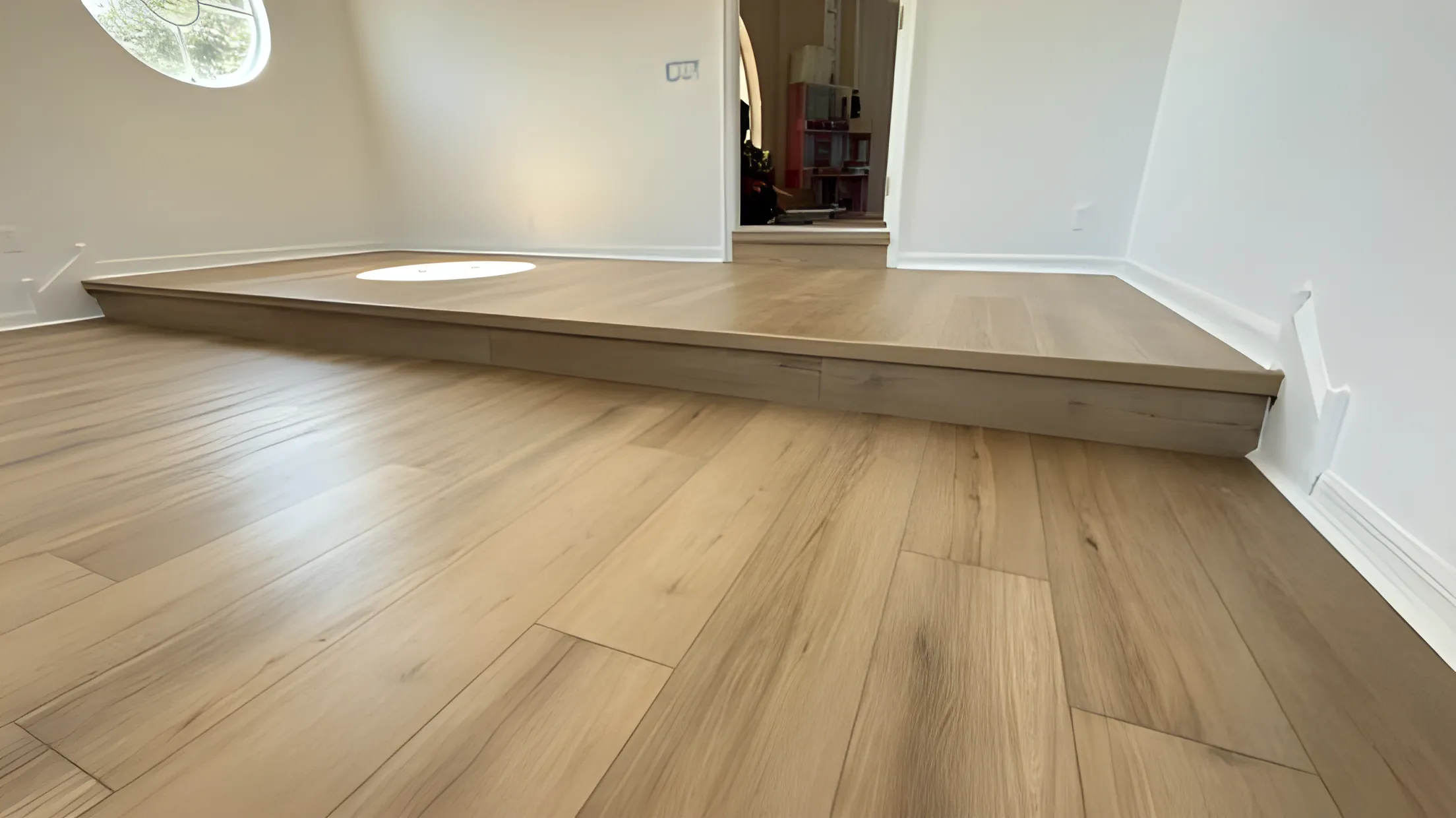 Light oak flooring on a step-down living room