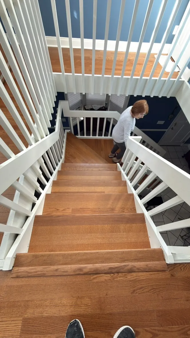 Staircase mid-installation with new treads in place