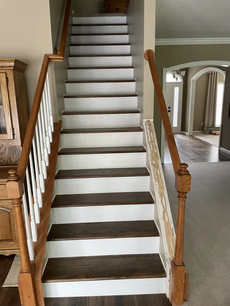 Full flight of stairs with wood treads and white risers