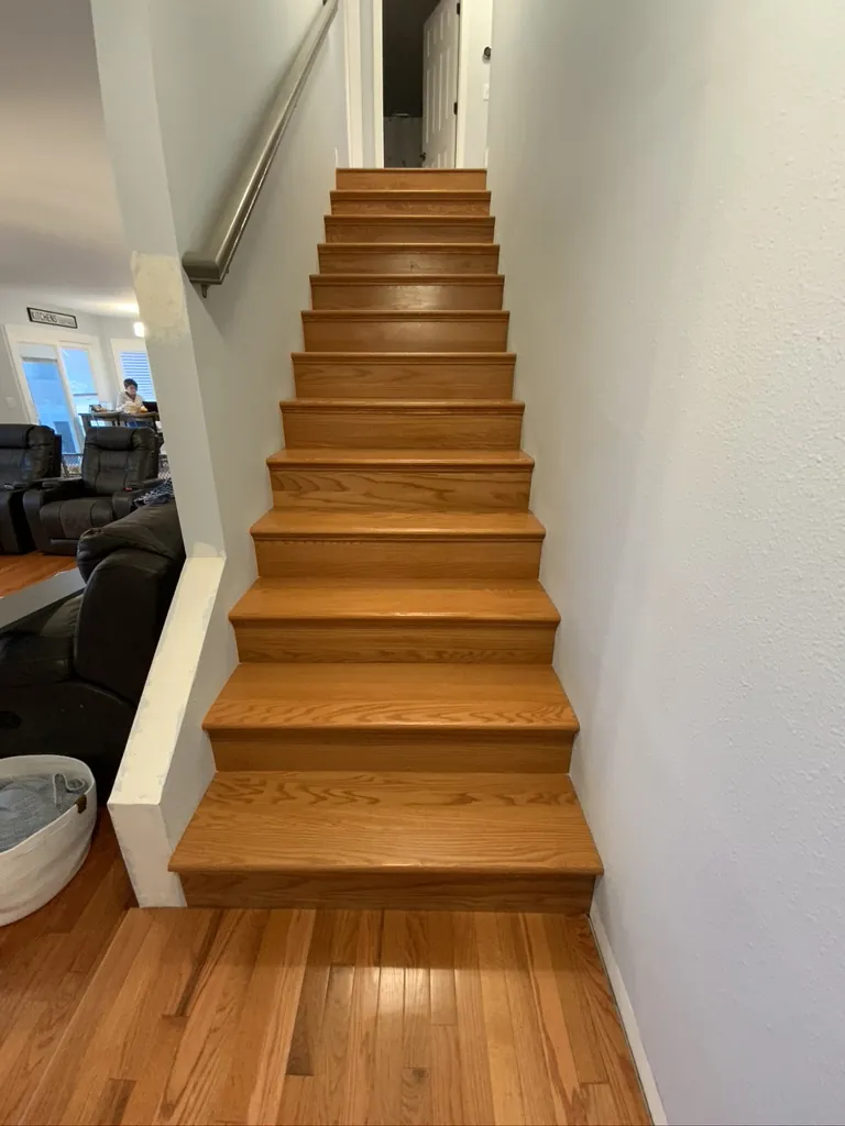 Golden oak staircase with finished treads and white risers
