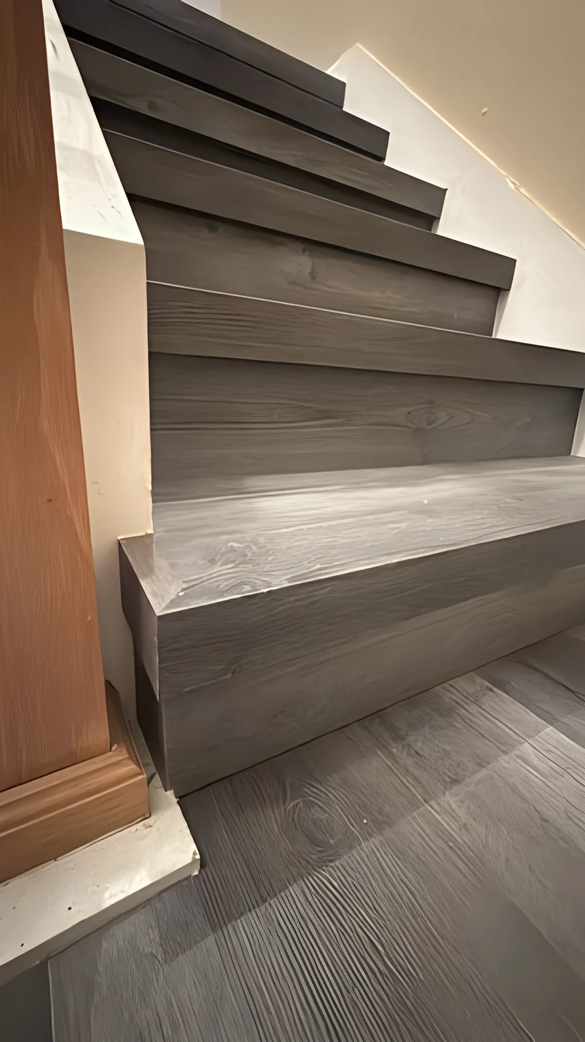 Gray vinyl plank stair treads on a residential staircase