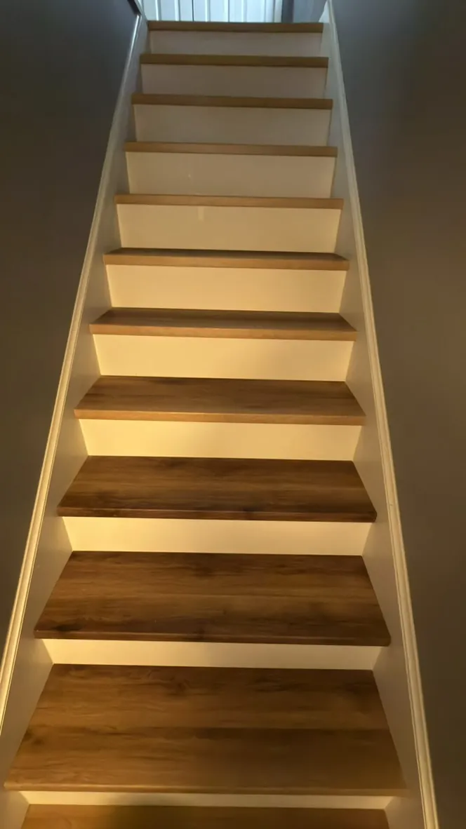 Oak stair treads with white risers on a full staircase